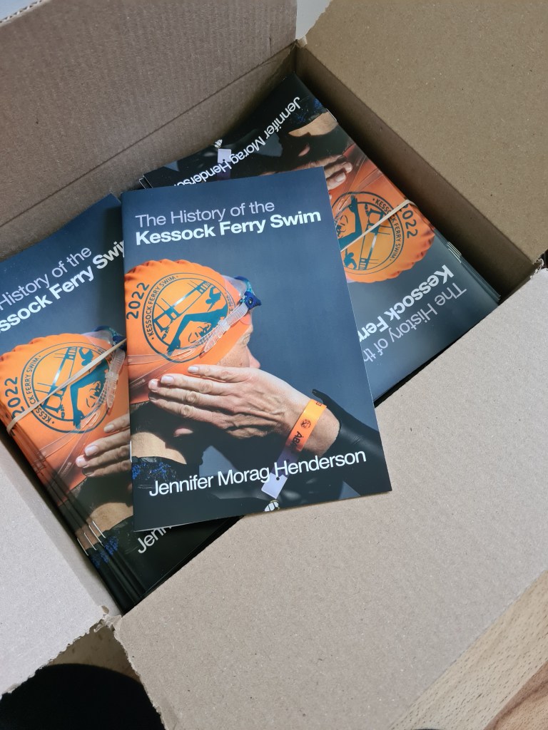 a box of the booklet "The History of the Kessock Ferry Swim" by Jennifer Morag Henderson