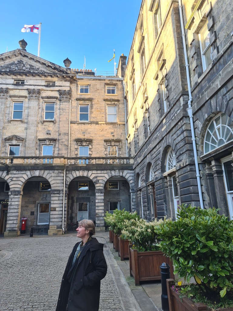 Jennifer Morag Henderson outside City Chambers, Edinburgh. A Faroese flag flies to mark Faroese Flag Day.